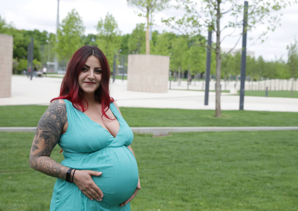 happy pregnant woman with tatto