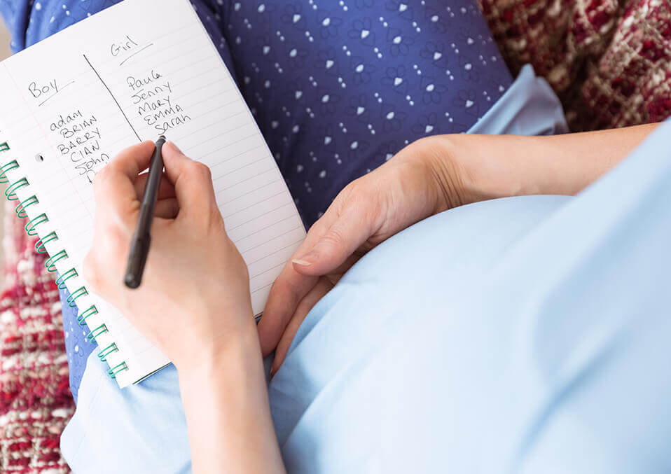 pregnant woman writing