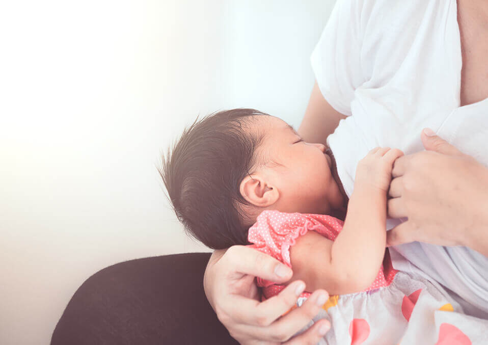 woman breastfeeding her baby