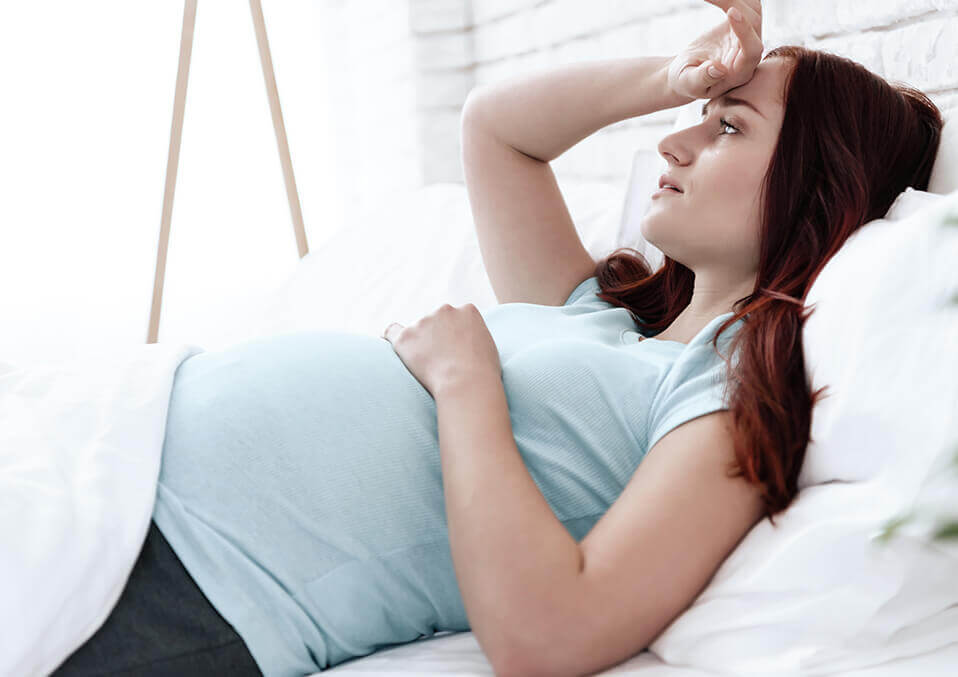 woman in pain of pregnancy